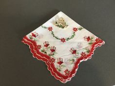 a white handkerchief with christmas decorations on it