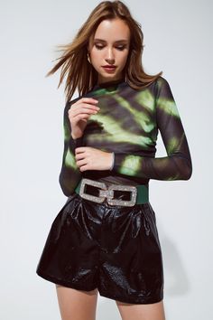 Embrace the urban charm and artistic allure with our Mesh Top Rouched At The Side In Abstract Green and Black Print. This captivating top is designed to make a bold fashion statement and express your unique style.    Featuring an abstract print that mesmerizes, this top adds a touch of artistic flair to any outfit. The high collar neckline and long sleeves lend an air of sophistication, making it perfect for both daytime and evening events.    Designed with a bodycon fit, this top highlights yo Top Highlights, Black Tie Dye, Party Outfits, Matching Accessories, Tie Dye Patterns, Running Tops, Green And Black, Tie Dye Print, The Urban