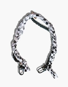 a black and white dog leash on a white background