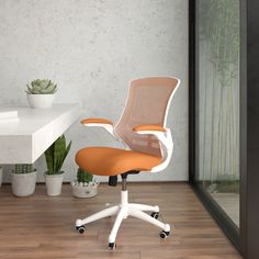 an orange and white office chair sitting on top of a hard wood floor next to a potted plant