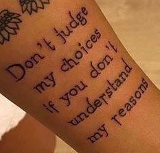 a person with a tattoo on their arm that says don't judge my choices if you don't understand my reason