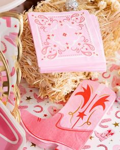 pink napkins and other items on a table