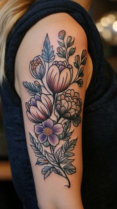 a woman with a flower tattoo on her arm