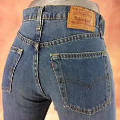 "Size 27 Vintage Levis 519 Distressed Medium Wash Red Tab Jeans W27 L31 High Waisted Straight Leg 90's Classic Mom Jeans Girlfriends Boyfriends Jeans Made In USA Brand: LEVIS 519-0217 Size On Tag marked W28 L36 but fits more like 27\" waist, 11.75\" rise, 23\" thighs, 40.5\" hips, 31.5\" inseam, 16\" leg opening! Fits a size 27, but check your measurements and compare the measurements with your garment. (see full measurement below) Recommended waist size: 27\" (27x31.5) *size 27 for a waist of 27 inches, expect your jeans to measure about 13.5\" across at the waist (Doubled 27\") to fit. Please follow our measurement guide: https://www.instagram.com/p/B2o273Kl5Oi/?igshid=1q5azikfj59p4 Material :  Cotton 100% Red Tab Made In USA Measurements:- All measurements are taken with the garment lay 90s Fitted Bottoms With Pockets, 90s Style Fitted Straight Leg Bottoms, 90s Fitted Straight Leg Bottoms, 90s Style Fitted High Rise Pants, Vintage High Rise Reworked Bottoms, Vintage Fitted Mid-rise Jeans, Retro Fitted Red Jeans, 90s Fitted Bottoms With Belt Loops, Vintage Red Denim Bottoms