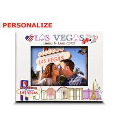 the las vegas sign is in front of an image of a man and woman kissing