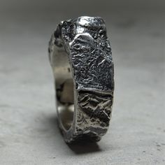 Project50g | Ocean ring- horizontal signet ring with an unusual texture of stone and molten metal – project50g Hand Forged Silver Ring With Thick Band, Hand Forged Sterling Silver Rings With Thick Band, Wide Band Hand Cast Rings For Anniversary, Anniversary Rings With Hand Cast Wide Band, Anniversary Hand Cast Wide Band Rings, Brutalist Hand Cast Open Ring, Unique Oxidized Wide Band Rings, Unique Hammered Rings With Thick Band, Unique Hand Cast Wide Band Rings