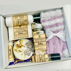 an open box containing bath products and towels