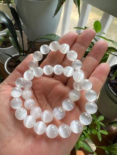 AAA Selenite Crystal bracelet. The Selenite is calcium sulfate mineral, all about purification, cleansing, and positive and calming energy. This crystal ability to cleans  another crystals surrounding. You must have many selenite in your collection!  Selenite is very fragile and can be easily scratched or chipped. Avoid water and handle with care. Natural crystal contains some inclusions, cracks, scratches, chips and discolorations. Slight variations of size, shape and color present. Please click on the photos to see the details. Hypoallergenic White Crystal Bracelet For Meditation, White Hypoallergenic Crystal Bracelet For Meditation, Selenite Bracelet, Hand-strung Crystal Bracelet For Meditation, Selenite Affirmation Crystals, Selenite Crystal, Witch Aesthetic, Crystal Bracelet, Natural Crystals