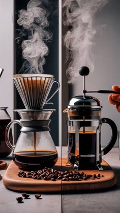 a coffee maker with steam coming out of it and some coffee beans on the table