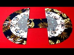 the letter h is made out of black and white paper with gold flowers on it