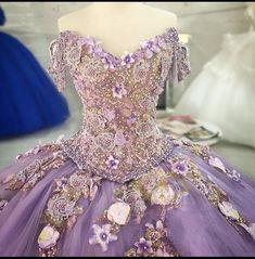 a purple ball gown with flowers on it