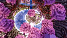 an aerial view of a city with lots of purple flowers