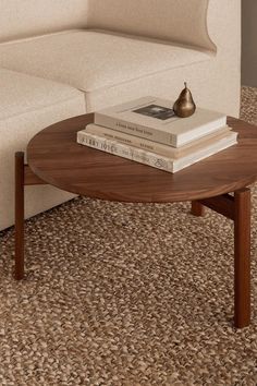 The Passage Lounge Table with interior books and the Sentiment Paper Weight Brass from Audo Copenhagen Wood Dowel Coffee Table, Natural Wood Coffee Table Mid Century, Walnut Coffee Table Round Set Cane, Gubi Coffee Table, Round Wooden Table, Walnut Vintage Coffee Table Round, Round Wooden Coffee Table, Lounge Table, Audo Copenhagen