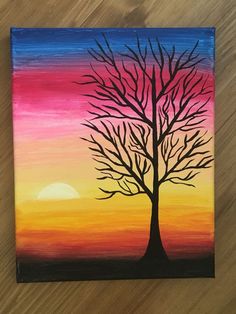 an acrylic painting of a tree with the sun setting in the background