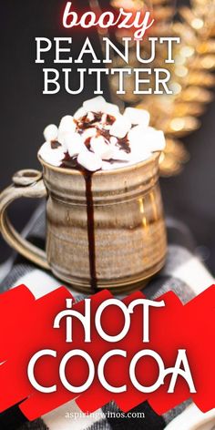 hot cocoa in a mug with marshmallows and whipped cream on top is the caption for this recipe