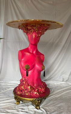 a pink sculpture sitting on top of a table