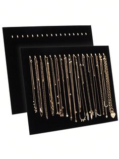 two display boards with various types of necklaces on them