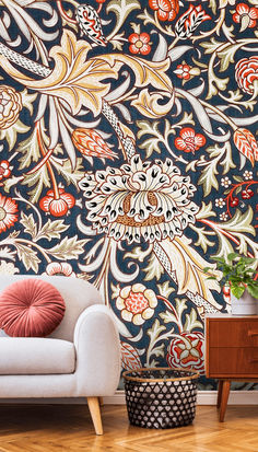 An accent wall is a fantastic way to bring color, character and style into a room. It's a simple but effective way of breaking up a solid color. We recommend going big and bold with your accent wall. It's a chance for you to captivate anyone who sees it and infuse a room with your personality. We love this William Morris wallpaper for an accent wall because it's dramatic, charismatic and beautifully detailed. Trent Wallpaper, Elegant Accent Wall, Floral Accent Wall, Moody Romantic Bedroom, William Morris Wallpaper, Inspired Wallpaper, Morris Wallpapers, Normal Wallpaper, Art Deco Wallpaper