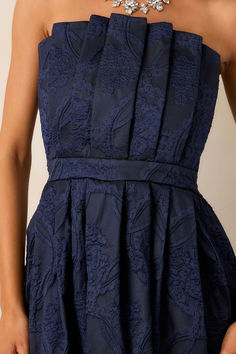 This elegant Moonstone Dreams Navy Floral Jacquard Midi Dress features a stunning floral design and a comfortable strapless neckline. Perfect for any occasion, it will make you feel confident and stylish. Let the simmering jacquard fabric embrace you as you dance the day or night away. This navy midi dress features a pleated bodice, a slightly pleated skirt, a jacquard design, functional hip pockets, a smocked back, a discrete back zipper and a strapless design.  82% Polyester & 18% Nylon  Unlined  Hand Wash Cold  Manufactured in China  Designed in The USA  Model is 5'8' & wearing a size small Cute Maxi Dresses, Women Red Dress, Pink Floral Print Dress, Blue Floral Print Dress, White Floral Print Dress, A Prom Dress, Preppy Girls, Maxi Dresses For Women, Sage Dress