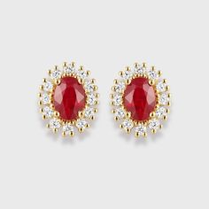 Add A Touch Of Elegance To Any Outfit With Our Delicate Earring Studs, Crafted With Lab Grown Diamonds And Beautiful Oval Cut Rubies. Luxury Red Oval Jewelry, Luxury Oval Ruby Jewelry, Yellow Gold Oval Halo Earrings, Elegant Red Oval Diamond Earrings, Classic Oval Cluster Earrings For Formal Occasions, Luxury Oval Bridal Earrings For Formal Occasions, Luxury Oval Bridal Earrings With Prong Setting, Yellow Gold Oval Diamond Earrings For Formal Events, Elegant Oval Cluster Earrings With Halo Design