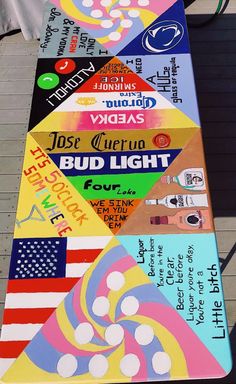 a long multicolored sign with many different things on it's sides and words