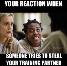 two women sitting next to each other in front of a sign that says, your reaction when someone tries to steal your training partner