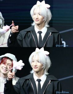 two people with white hair and bunny ears on their heads, one wearing a black jacket