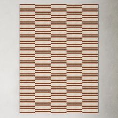 a brown and white rug with horizontal stripes on the bottom, in an diagonal pattern