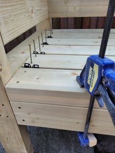 a bed frame with tools on top of it