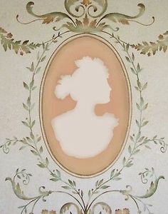 an old photo of a woman's profile on a wall