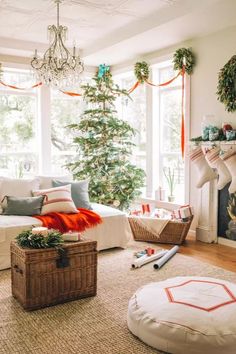 a living room with a christmas tree in the corner