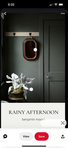 an image of a room with green walls and white flowers in the vase on the table