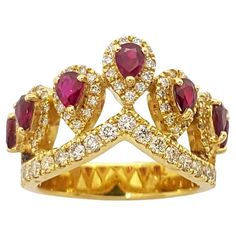 Ruby 1.32 carats with Brown Diamond 1.01 carats Ring set in 18K Gold Settings Width: 2.4 cm Length: 1.8 cm Ring Size: 54 Total Weight: 10.03 grams "We first opened doors in 1980 when it was then situated in the vicinity of the Victory Monument; a small and modest storefront with a couple of counters. From its humble beginnings to where it stands today, our company has proven its abilities as a jeweler. Since the beginning, we have been supplying fine quality pieces to dealers, wholesalers and customers worldwide. From then till now, our business still interrelates its name with quality products and excellent service, where commitment and sincerity toward customers will always be its motto." Diamond Crown Ring, Diamond Crown, Crown Ring, Gold Crown, Brown Diamond, Tiaras And Crowns, Cocktail Rings, Ring Set, Ring Sets