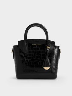 Luxurious and functional, this Harper top handle bag with a croc-effect finish will easily become a new favourite that you will reach for again and again. Whether you are headed to work, evening events or a special occasion, it will be a fabulous style companion. Plus, in black, it will always be a failproof choice that will match with everything in your wardrobe - perfect for days when you want to look classy with effortless ease. Burgundy Bag, Chic Crossbody Bag, Structured Top, Size Chart For Kids, Classic Handbags, Charles Keith, Printables Kids, Handle Bag, Black Tote Bag