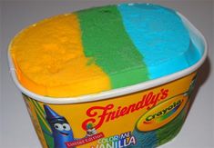 there is a cup of ice cream with different colors on it