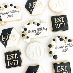 decorated cookies with black and white icing for 50th birthday