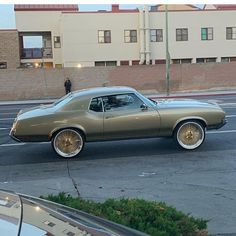 an old car parked on the side of the road