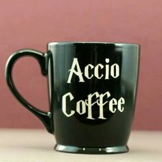 a black coffee mug with the words acio coffee on it