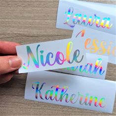 three stickers with the words, nameless and hologise in different colors