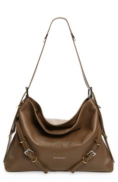 New to Givenchy, this belted leather hobo combines elevated sophistication with creative director Matthew Williams's hardware-heavy aesthetic. Open top Adjustable shoulder strap Interior zip pocket Lined Leather Made in Italy Designer Handbags Versatile Brown Shoulder Bag With Removable Belt, Designer Leather Hobo Bag For Work, Designer Leather Hobo Bag With Metal Hardware, Chic Formal Hobo Bag With Gunmetal Hardware, Modern Shoulder Bag With Removable Belt, Chic Shoulder Bag With Removable Belt, Designer Hobo Bag With Palladium Hardware For Office, Formal Leather Hobo Bag With Gunmetal Hardware, Luxury Formal Hobo Bag With Gunmetal Hardware