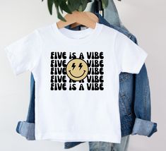 a white t - shirt with the words five is a wire and a smiley face