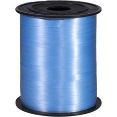 a spool of blue curling thread on a white background