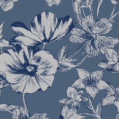 a blue and white floral wallpaper with large flowers on the left side of it