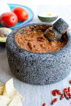 a tortilla bowl filled with salsa and chips