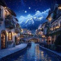 a river runs through the middle of a town at night with mountains in the background