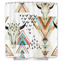 a shower curtain with an animal's skull and geometric designs on it, in white