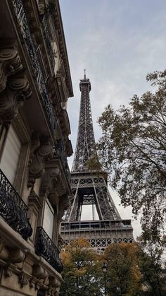 the eiffel tower in paris, france is seen from outside an apartment building