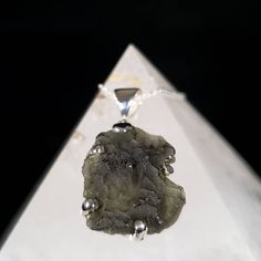 "Say hello to your new genuine raw Moldavite pendant set in sterling silver. Moldavite is known to open the mind to limitless possibilities and it works on all of the chakras in the body, dissipating any energetic blockages that are found. The high cosmic energy of moldavite can be quite intense and spur quick changes. It speeds up your entire energetic system while opening the third eye and heart chakras. Moldavites have been prized since the beginning of time. Perhaps even more rare than diamo Sterling Silver Gemstones With Natural Inclusions, Sterling Silver Pendant With Natural Inclusions, Venus Of Willendorf, Moldavite Pendant, Goddess Statue, Astral Travel, Cosmic Energy, Wicked Witch, Moonstone Pendant