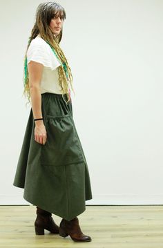 Hippy Skirt Our Hippy Style Skirt is cut in the same silhouette as our Hippy Dress and Aprons. Its side seams are cut on the bias, allowing its satisfying swish of its drape, falling gently around you as you work and play. Over-sized, gathered pockets are designed to fit and fill easily, without gaping or spilling as you move and bend. Wear it over jeans for the ultimate as a half apron coverage or dress it up with your favorite top as your go to skirt for the day. It will look perfect;with your Spring Bottoms With Asymmetrical Hem And Gathered Skirt, Spring Cotton Asymmetrical Cargo Skirt, Spring Tiered Cargo Skirt, Asymmetrical Relaxed Cargo Skirt For Spring, Relaxed Asymmetrical Cargo Skirt For Spring, Casual Asymmetrical Voluminous Skirt, Casual Voluminous Asymmetrical Skirt, Spring Tiered Skirt With Side Pockets, Asymmetrical Cotton Skirt For Fall