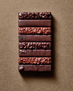 four pieces of chocolate sitting on top of each other